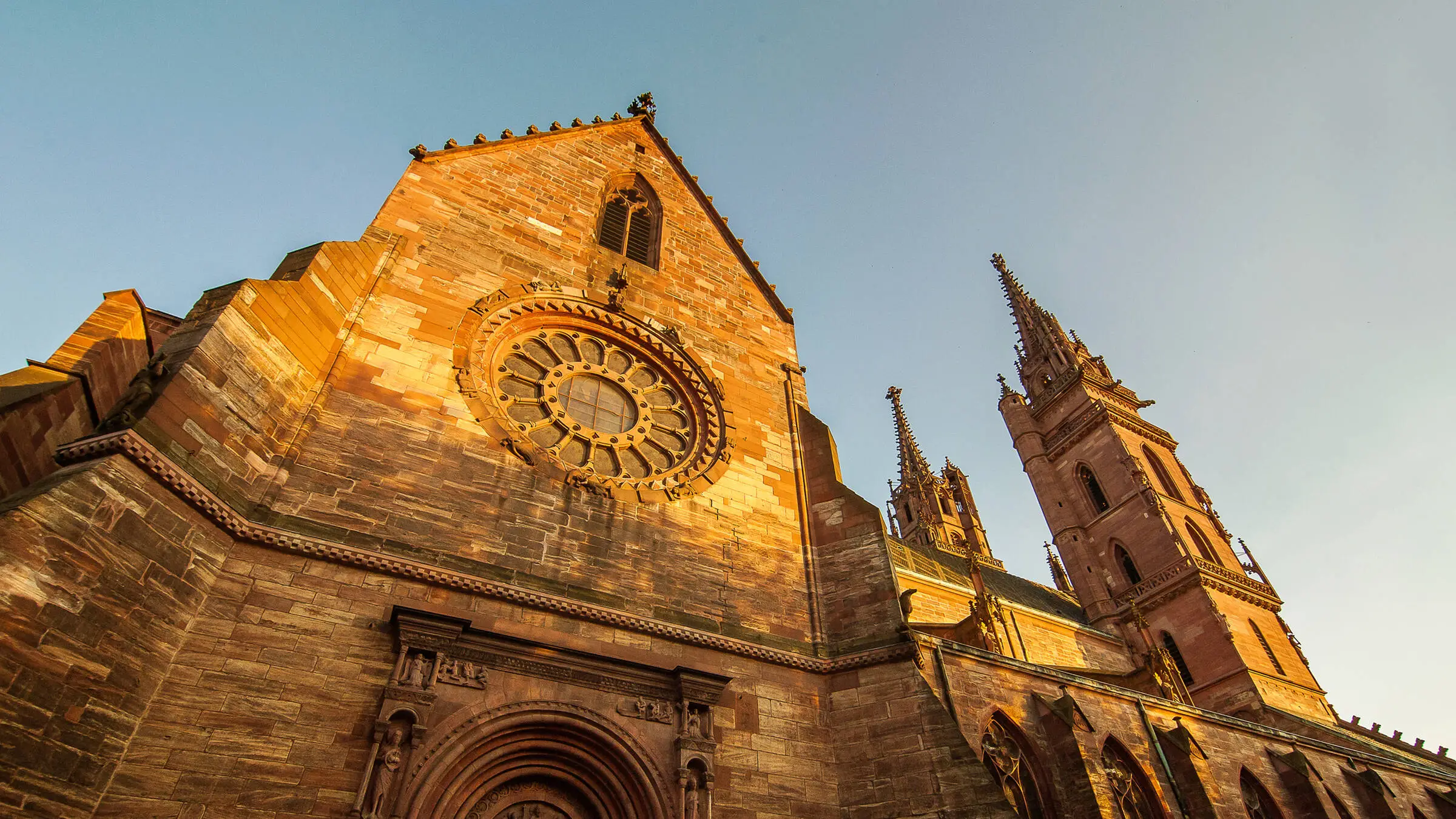 Basel Minster from below at sunset